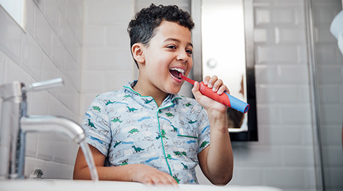 Boy brushing teeth